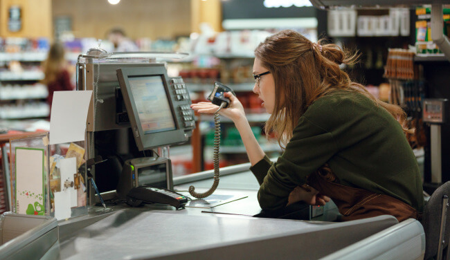 Confused angry checkout assistant cashier