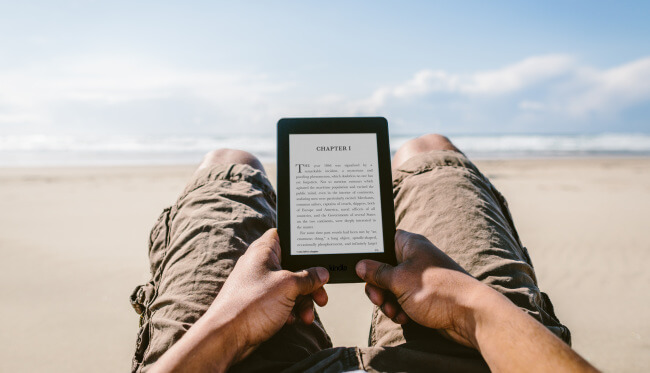 Amazon Kindle reading on beach