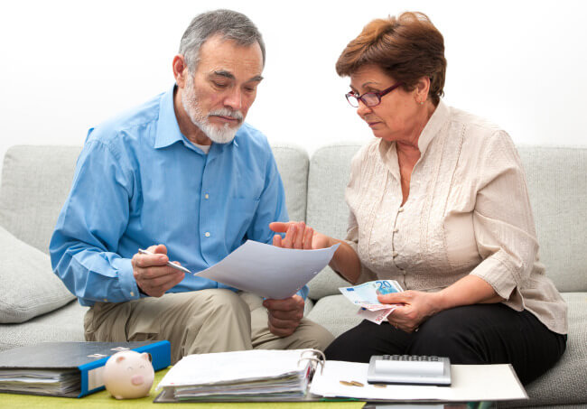 Elderly couple doing budget and money