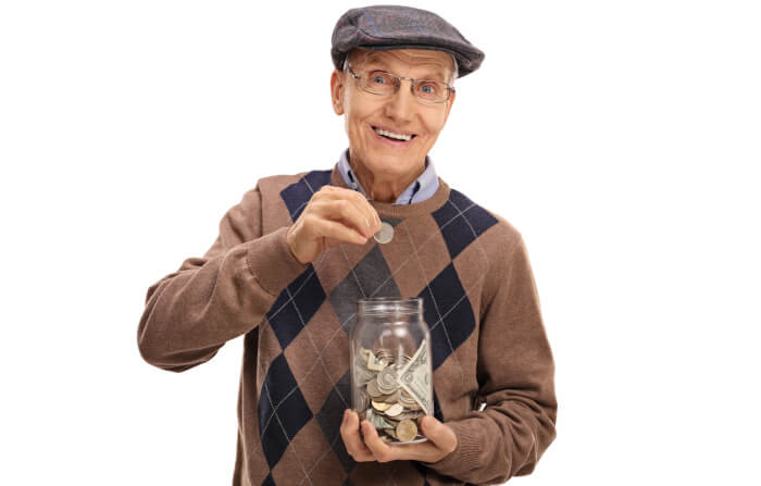 Old man saving money in a jar