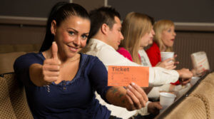 Woman holding theatre ticket 1100